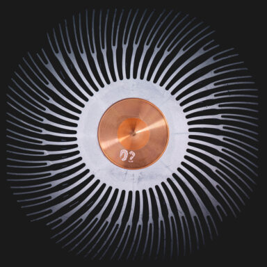 Close-up photograph of a circular processor cooling unit in copper brown and steel grey metal, captured from above for an irritatingly hypnotic and detailed view.  Get this digital image in high resolution for print or other purposes.  All prices excluding VAT. You may be charged VAT depending on your region (if you are from the EU for example).