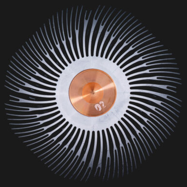 Close-up photograph of a circular processor cooling unit in copper brown and steel grey metal, captured from above for an irritatingly hypnotic and detailed view.  Get this digital image in high resolution for print or other purposes.  All prices excluding VAT. You may be charged VAT depending on your region (if you are from the EU for example).